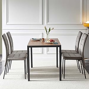 Modern dining set featuring a rectangular table with white top and dark legs, paired with gray upholstered chairs, shown from multiple angles in a bright room.