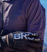 Close-up detail of dark athletic wear showing 'BRCC' branding on the fabric.