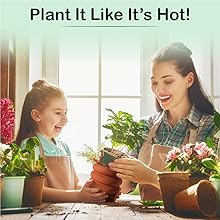 Smiling Mother and Daughter Look Happy Spending Quality Time Indoor Gardening Together