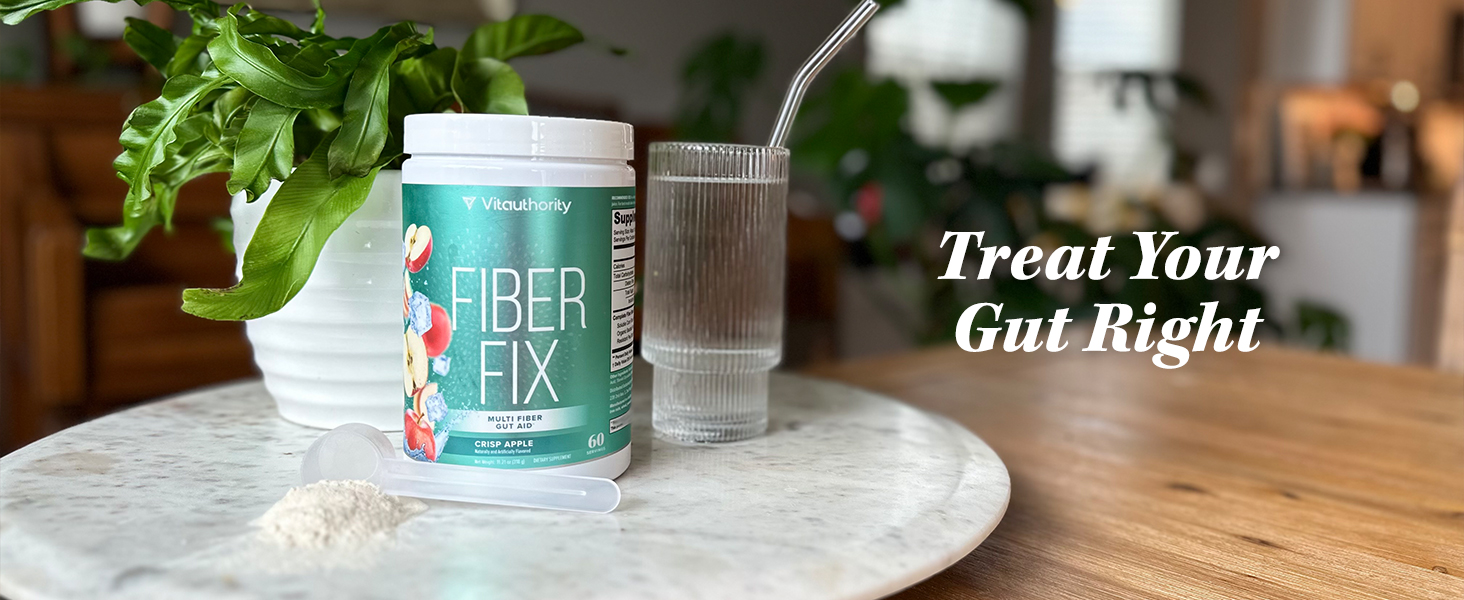 Single bottle of Fiber FIx next to a glass of water and powder pile