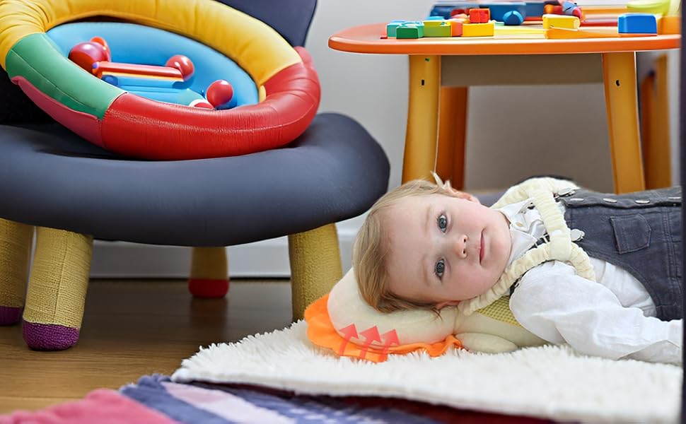 baby lying on the floor with backpack on
