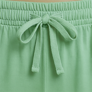 Pajama waistband close-up with elastic band and drawstring for adjustable fit.