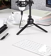 Multiple views of a modern office desk setup with white desk surface and clean minimalist styling.