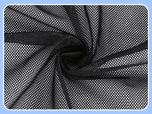 black and white polka dot mesh fabric with a white background