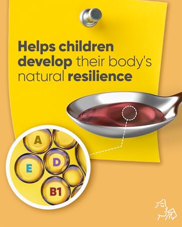 Spoon with liquid vitamins A, D, E and B1 supporting natural resilience