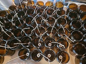 9oz Amber Candle Jars being wicked before adding wax