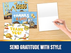 "A hand holding the construction thank you cards ."