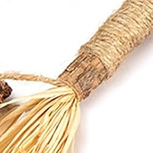 a close up of a rope with a wooden handle.