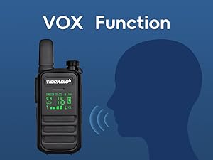 Text reads: 'VOX Function'. Marketing image showing black two-way radio with green digital display against blue background with silhouette profile.