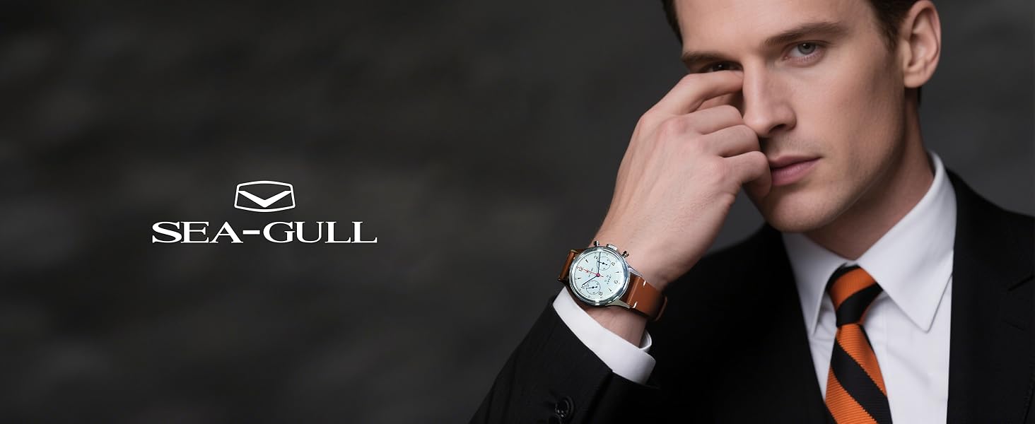 Wristwatch with round white face and brown leather strap worn by person in suit. Seagull brand logo visible above.