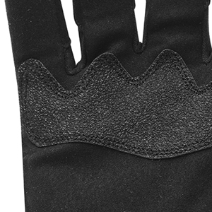 Close-up of a black textured surface, possibly part of a glove or grip material. Shows a wavy pattern with contrasting smooth and rough areas.