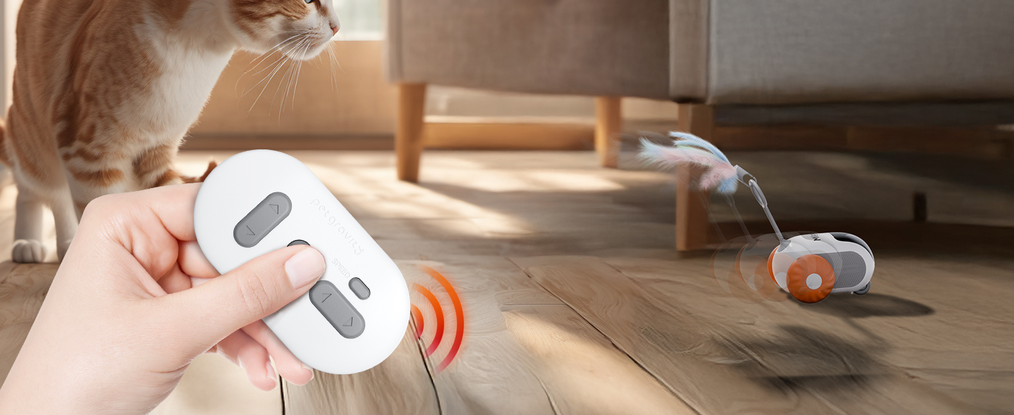 Elektronisches Gerät mit weißer Fernbedienung, das orangefarbene Signalwellen aussendet. Dargestellt bei der Interaktion mit einem sphärischen Objekt auf dem Boden