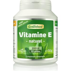 une bouteille de vitamine E, un aliment vert