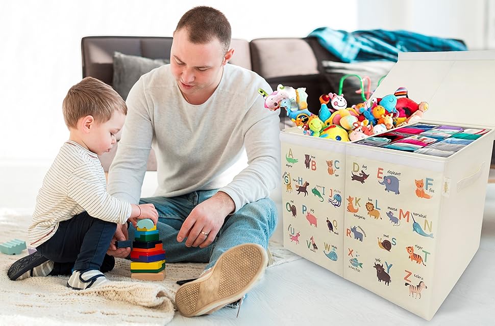 Father and son playing with toys an Alphabet storage box contains vast amount of toys