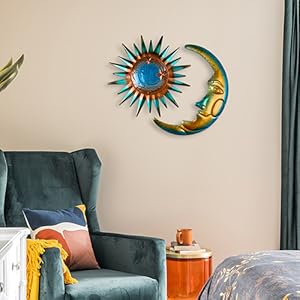 The sun and moon decor hang separately on the wall