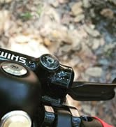 Series of product shots showing a bicycle handlebar mount system being installed and used, demonstrating the mounting process and functionality on different bike handlebars.