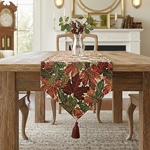 red and green autumn fall leaves foliage thanksgiving table runner on a dining table setting