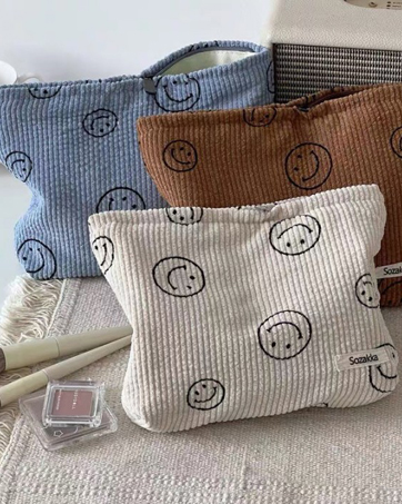 bolsa de maquillaje de cara sonriente