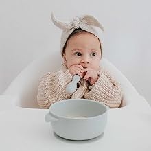 baby eating from bowl