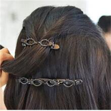 Take out the medium hairpin