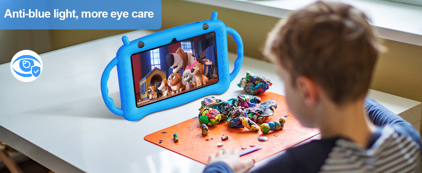 Child using a blue protective tablet case while watching content, surrounded by colorful building blocks on an orange surface.