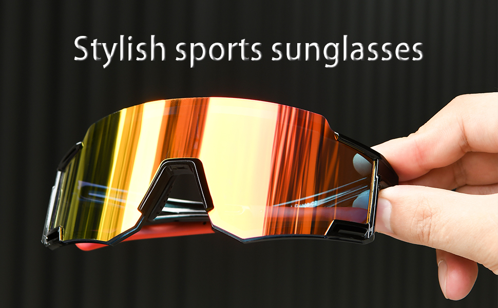 The model holds a pair of stylish sports sunglasses