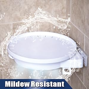 Water splashing all around the white shelf affixed on the corner beige tiled bathroom. 