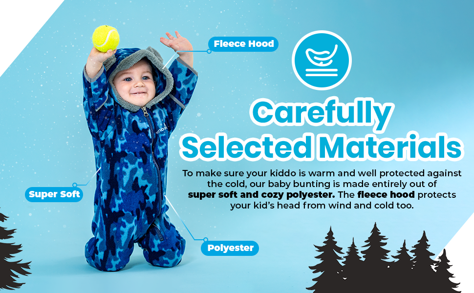 baby winter suit playing with ball