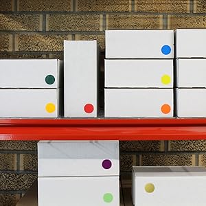 boxes on shelf with color coding dots, inventory, packing, shipping