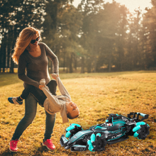 Woman and child playing, race car