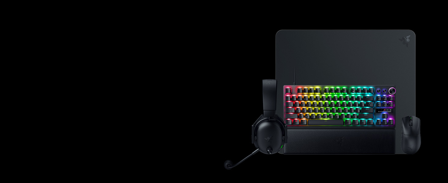 Clavier de jeu avec touches rétroéclairées RGB affichées sur fond sombre. Les touches présentent un effet d'éclairage de couleur arc-en-ciel.