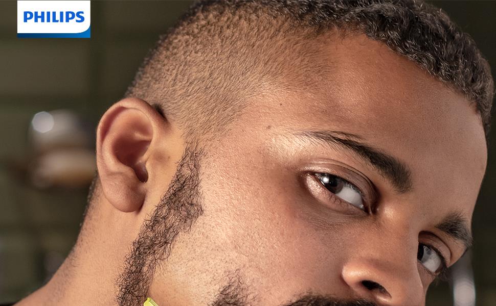 Man using the Philips OneBlade to shave and style his beard