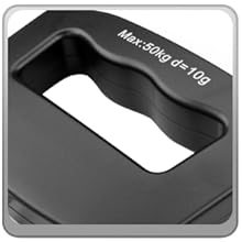 Device on kitchen table reading ounces; a digital scale for travel luggage that’s also a luggage