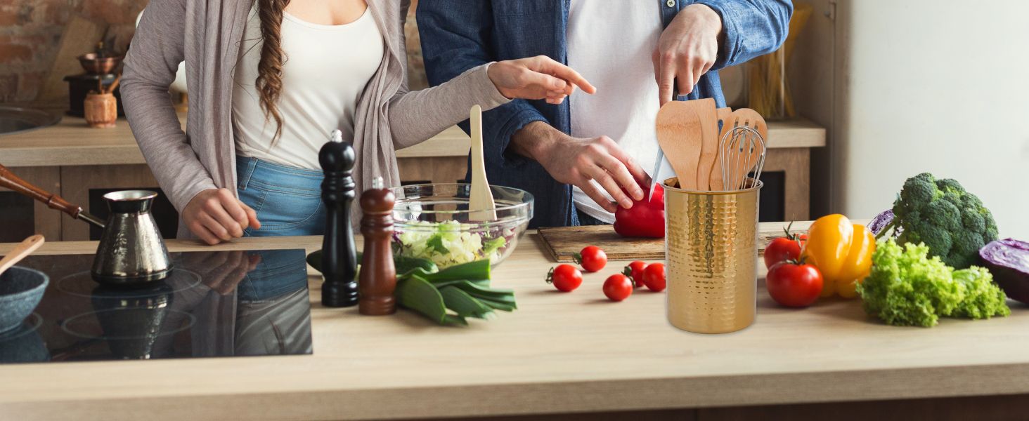 Utensil Holder on counter with people cooking in background