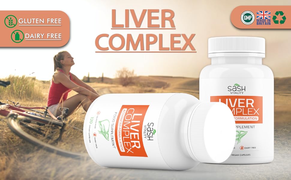 healthy smiling woman sitting on grass withy bike with gluten free dairy free liver complex capsules