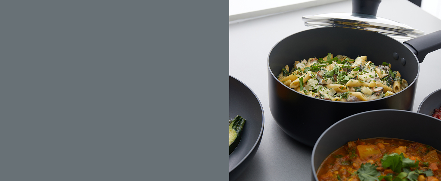 easy clean cooking saucepans with pasta and soup in kitchen 