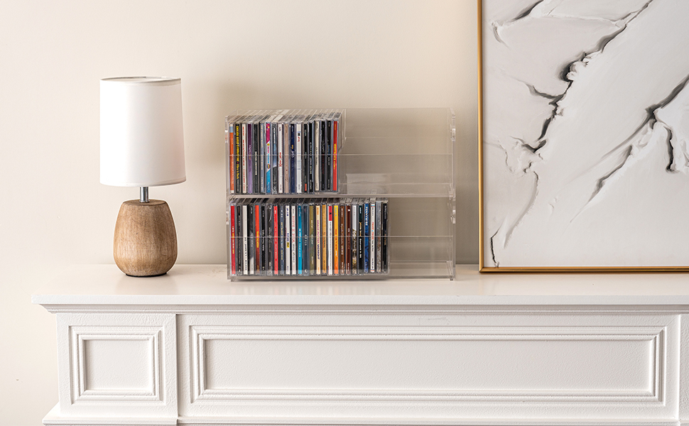 clear acrylic CD compact disc holder rack bins with dividers displayed on a mantel