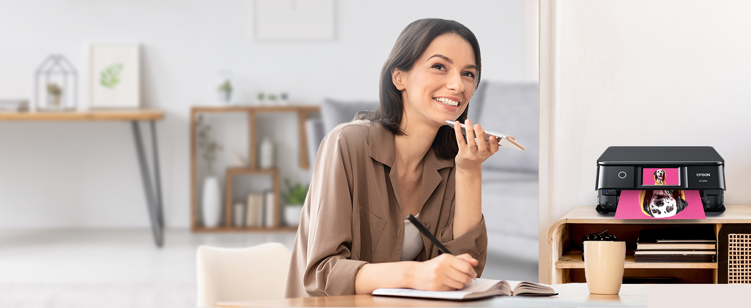 Person using voice-activated printing feature from their smartphone to print a photo