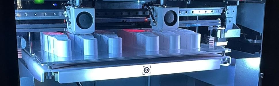 3D printer creating object with PLA filament on heated bed