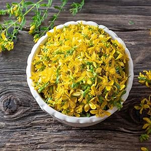 Image of cut yellow flowers laying in a white bowl