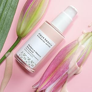 Alpyn Beauty Bearberry & Vitamin C Glow Serum on flowers.
