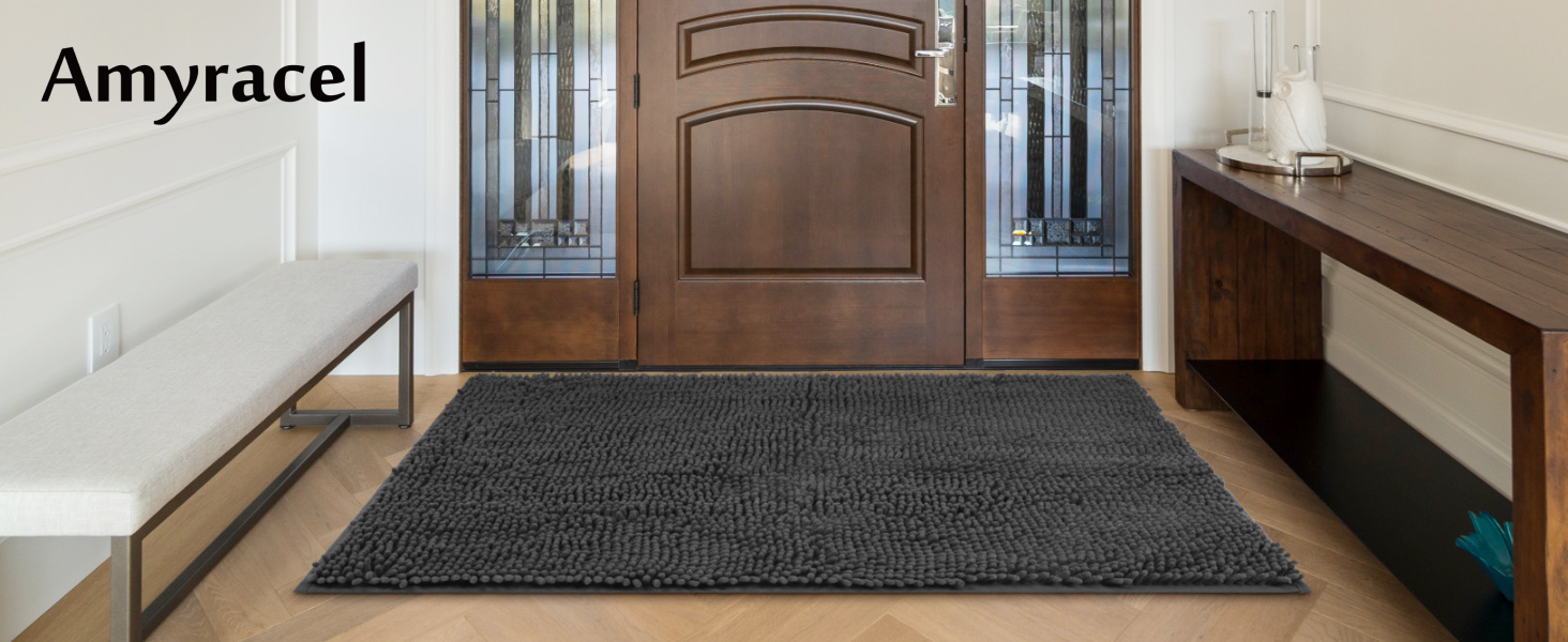 A large absorbent front door mat is placed in the tidy interior doorway.