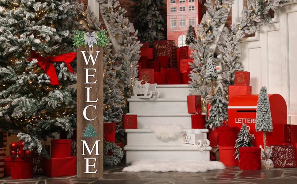 A festive Christmas scene with a &#34;WELCOME&#34; sign, snow-dusted trees, red gifts, and lit decorations.