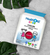 White packet of HealthPull Kids protein powder against a white background with green leaves. Package features cartoon children and fruit illustrations.
