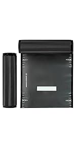 Black and Clear vacuum bag roll standing next to one slightly unrolled