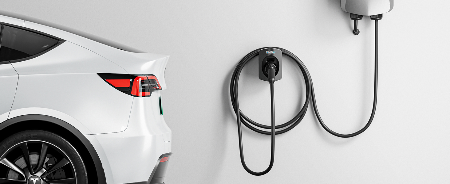 Wall-mounted electric vehicle charging cable organizer shown with coiled black charging cable near a white car.
