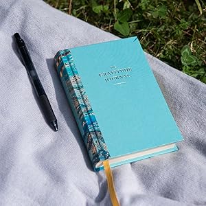 A photograph of The Gratitude Journal with a pen. 