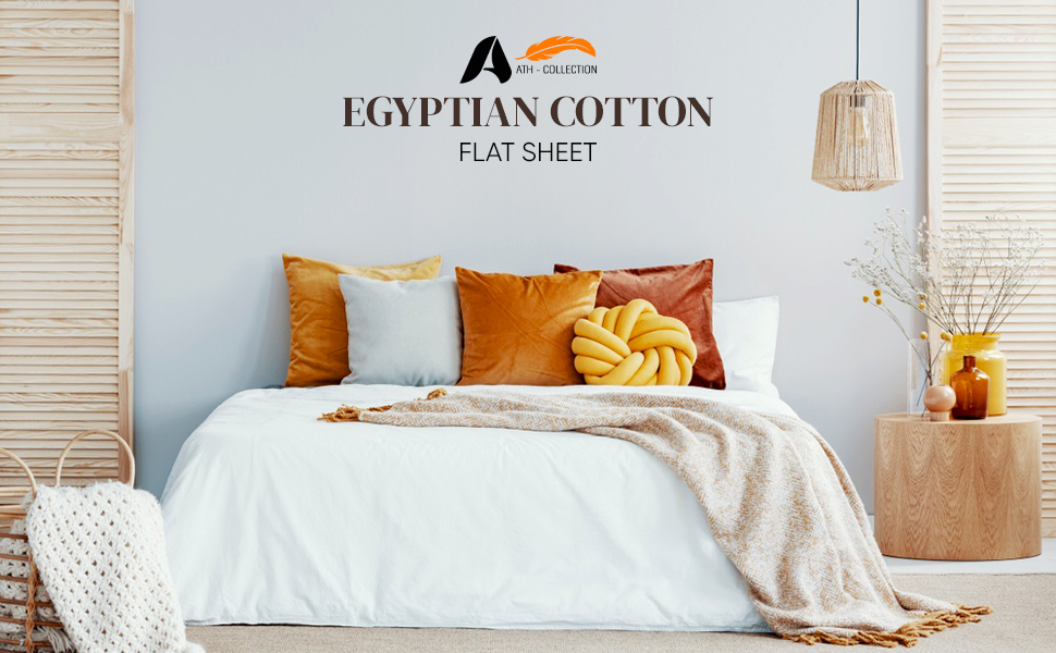 Bedroom shot, showing flat sheets with cushions and quilt on it
