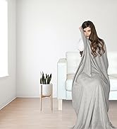 girl covered by a boacay gray travel blanket