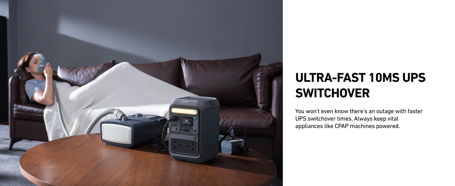 Uninterruptible power supply (UPS) device on coffee table in living room. Person on couch in background. Text advertises ultra-fast 10ms UPS switchover feature.